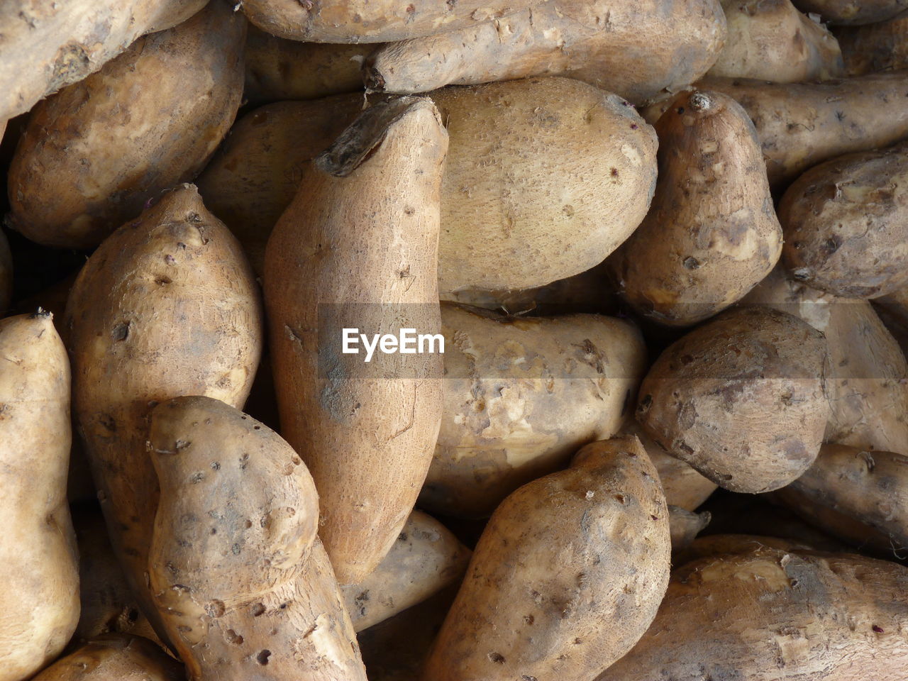 Full frame shot of sweet potato for sale at market stall