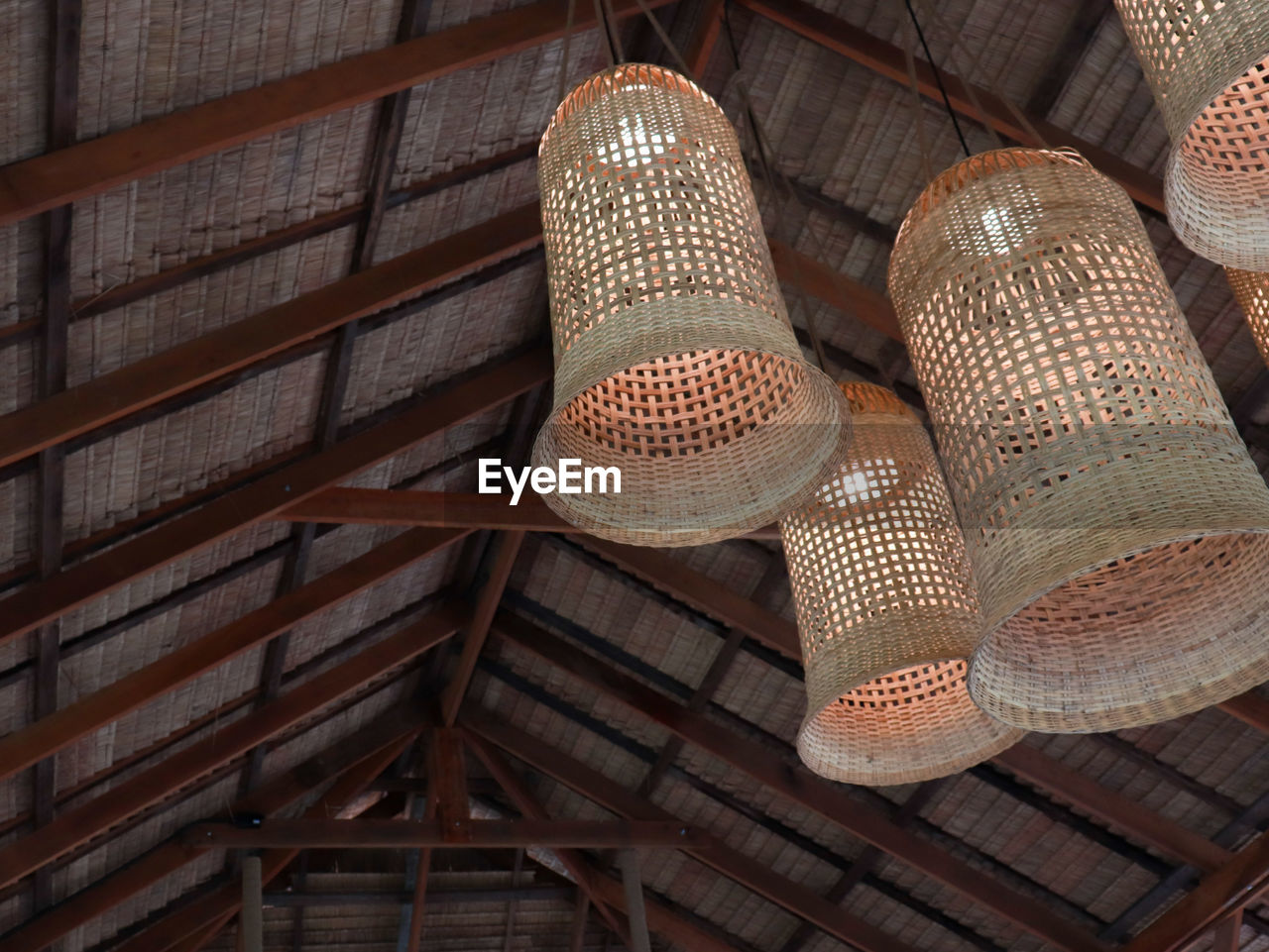 Low angle view of lighting equipment hanging on ceiling