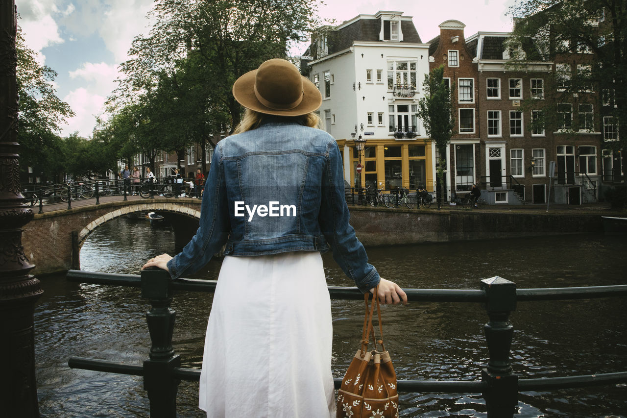 Woman overlooking canal and city