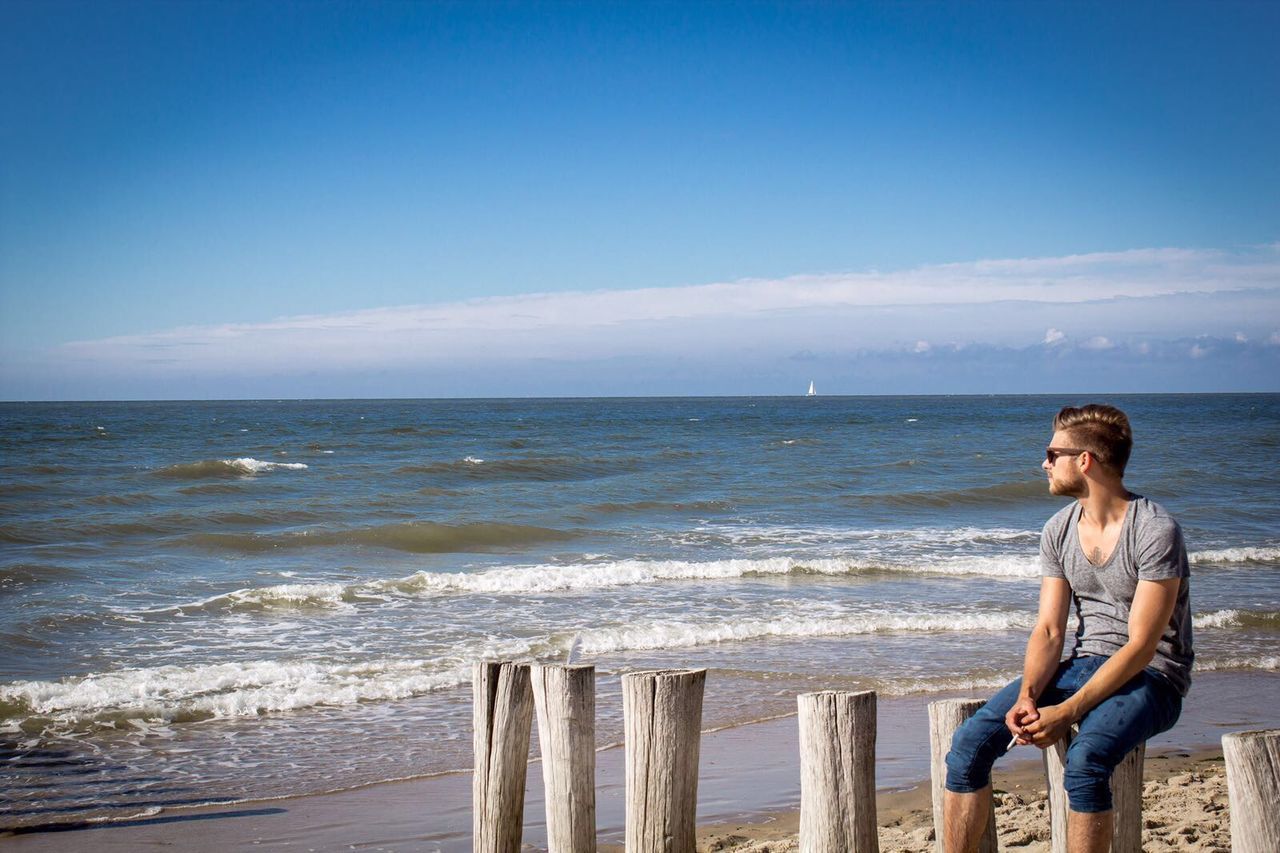 Man day dreaming at the seaside