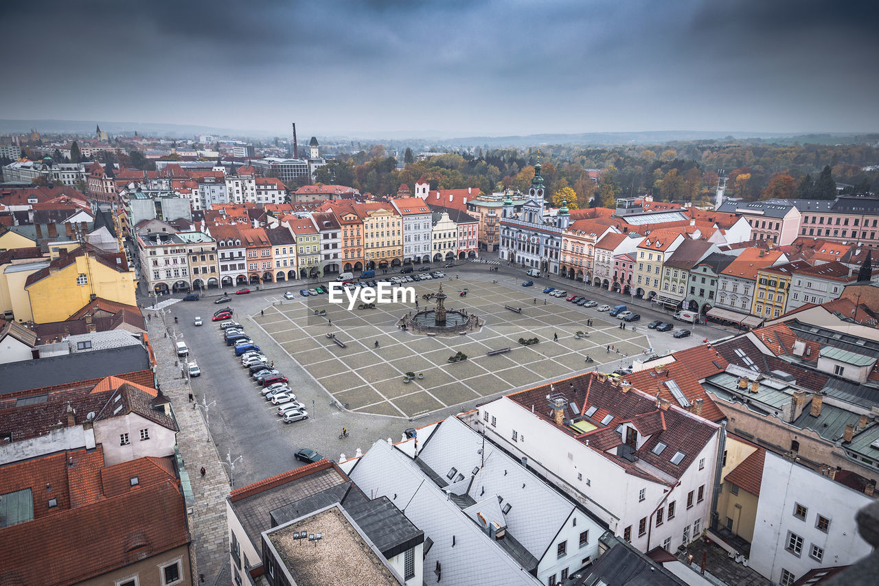 Town square against cloudy sky