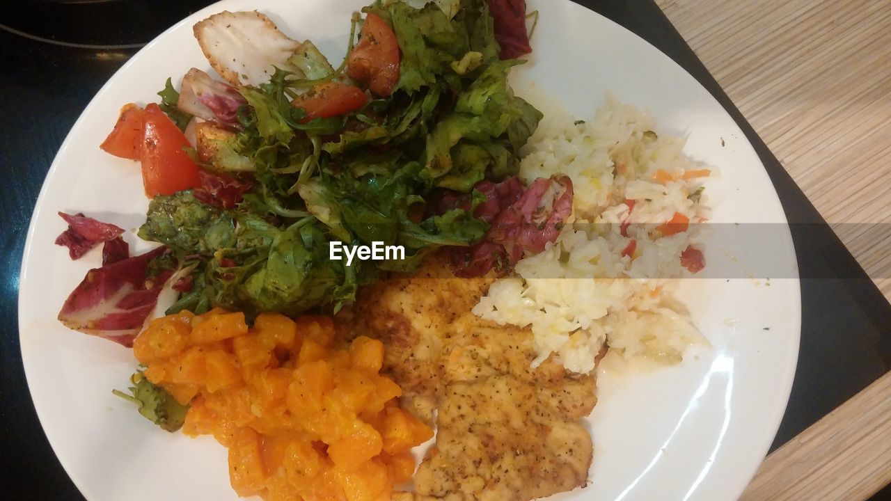 High angle view of dinner in plate on table