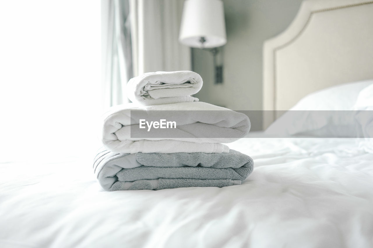 Towels on bed in hotel room