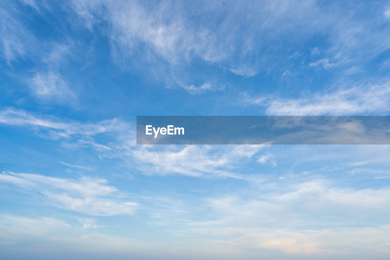 sky, cloud, blue, horizon, daytime, scenics - nature, nature, beauty in nature, environment, cloudscape, backgrounds, tranquility, tranquil scene, no people, sunlight, idyllic, copy space, outdoors, atmosphere, azure, day, white, landscape, wind, low angle view, dramatic sky, summer, sparse, fluffy