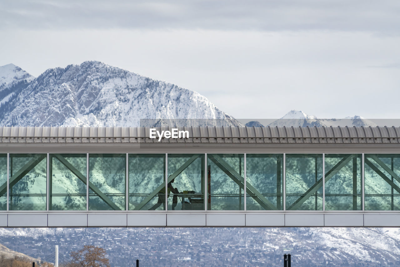 SNOW COVERED MOUNTAIN AGAINST SKY