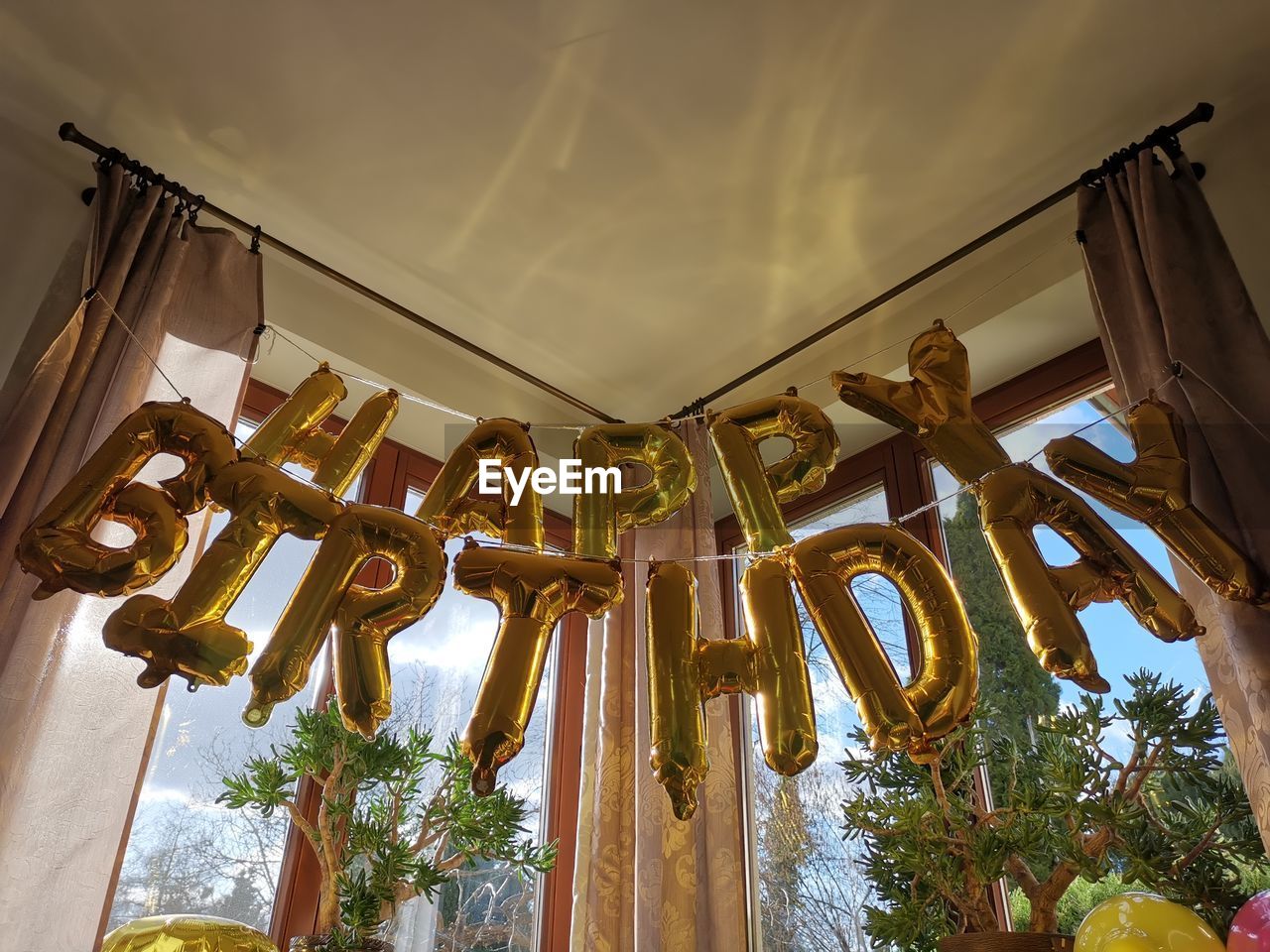Low angle view of happy birthday sign