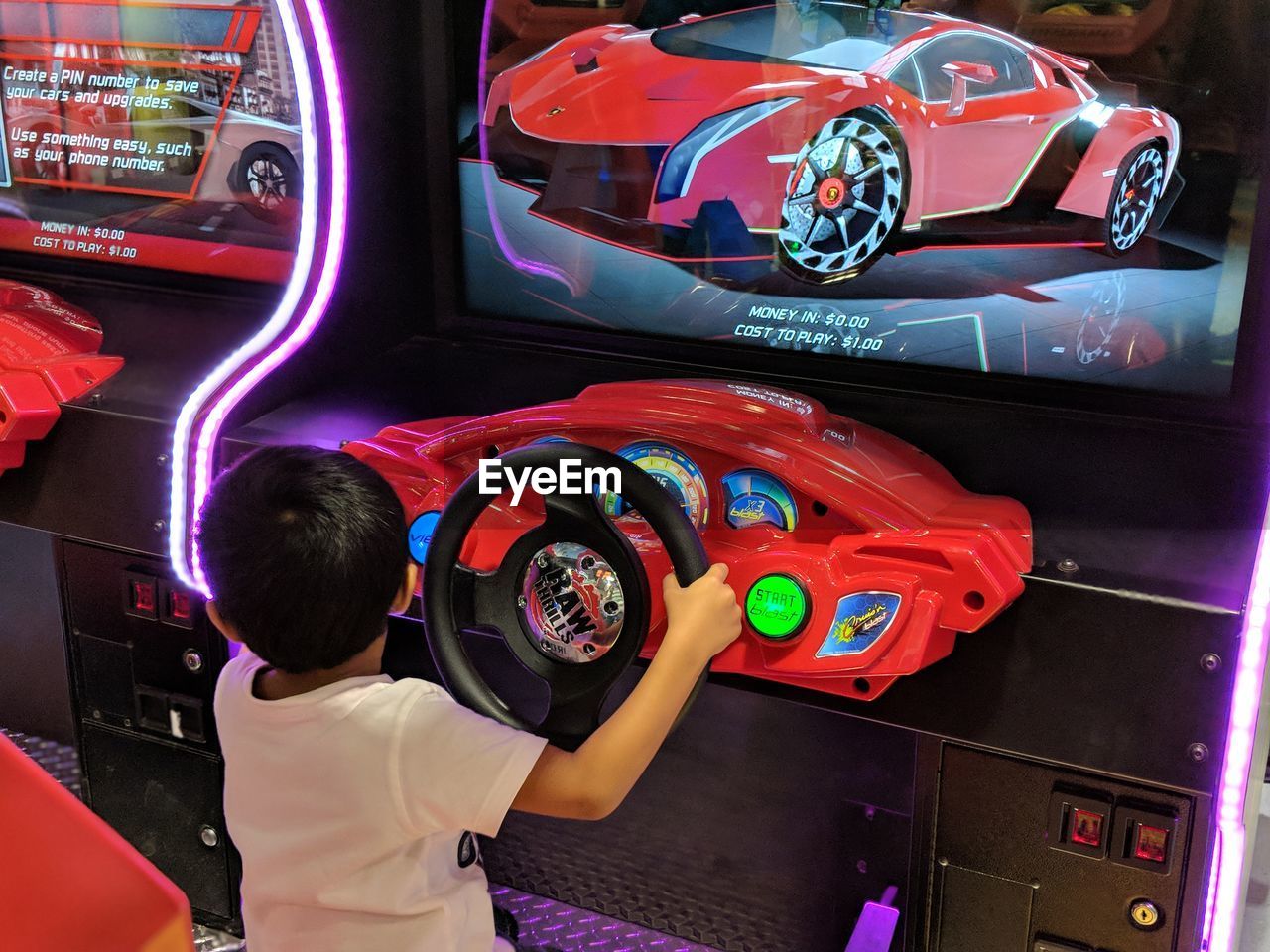 FULL LENGTH REAR VIEW OF BOY PLAYING WITH TOYS