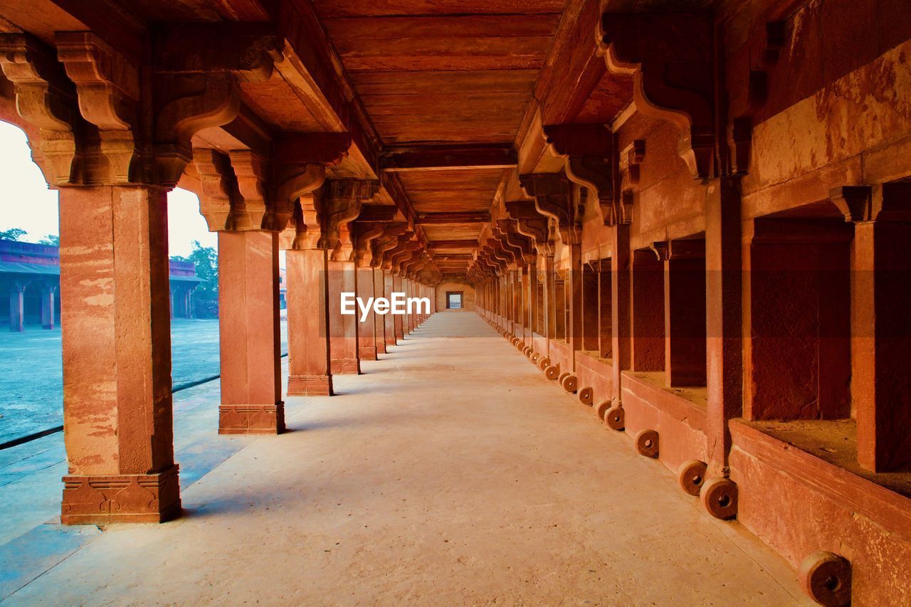 Huge horse stable inside ancient king's palace in india. little hole in the right bottom is to tie. 