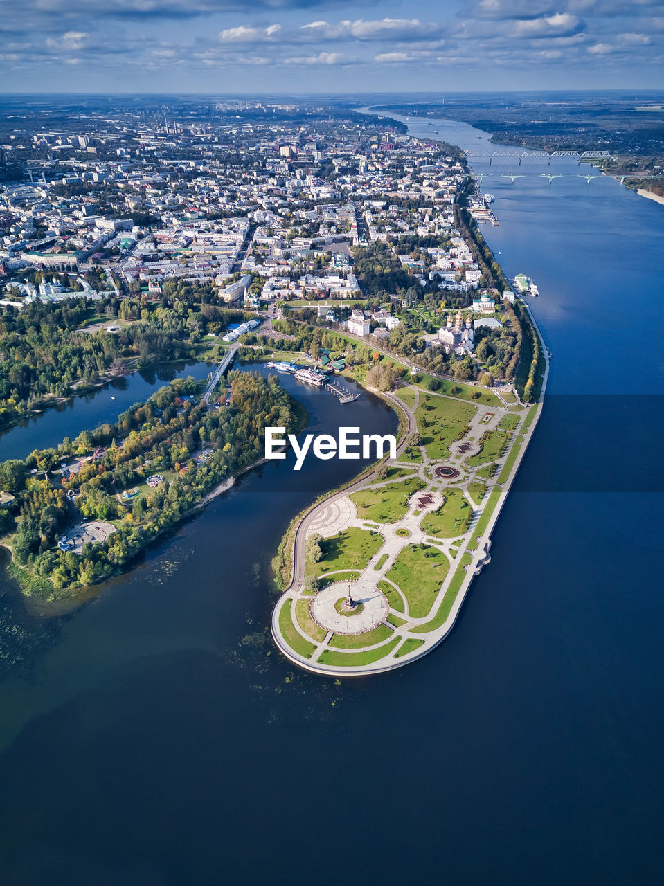 Aerial view of park by city amidst volga river and kotorosl river on sunny day