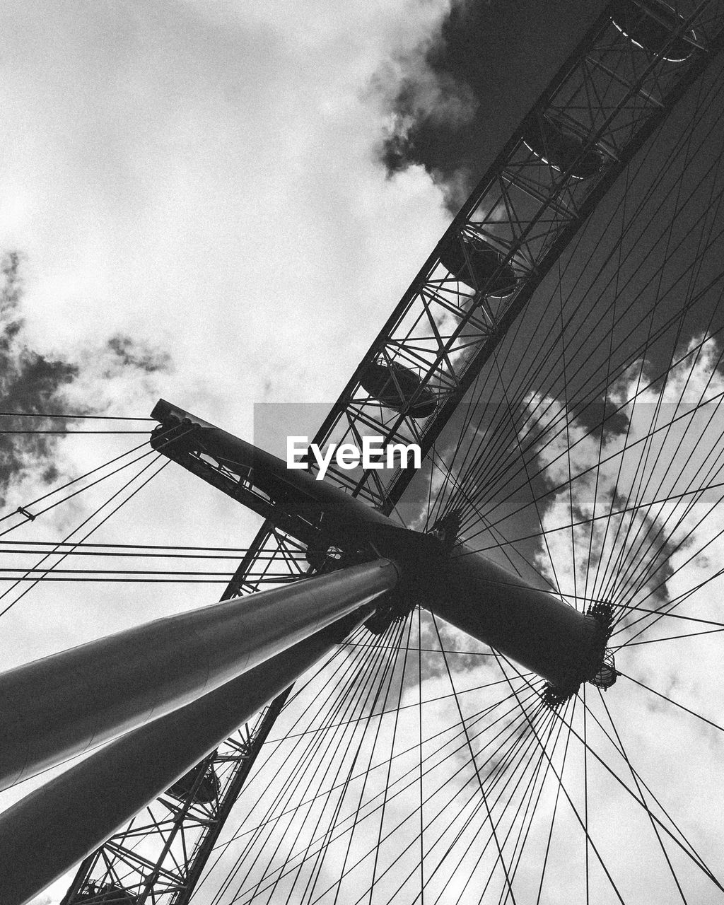 LOW ANGLE VIEW OF ROLLERCOASTER AGAINST SKY