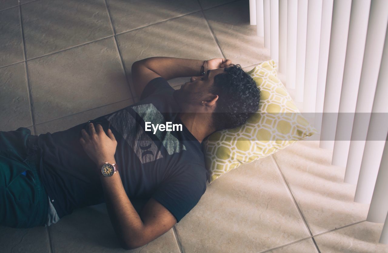 Man lying down on the floor
