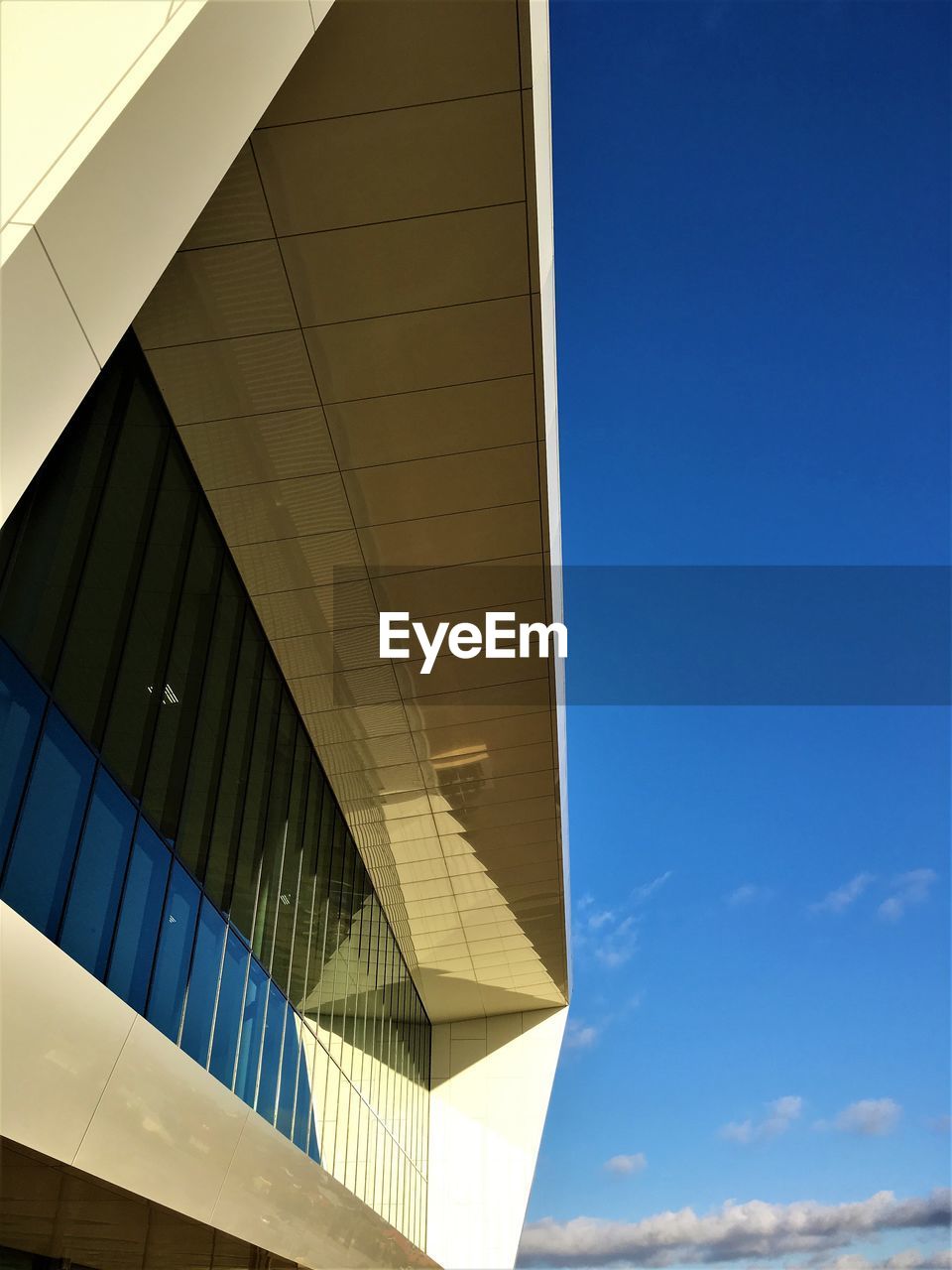 LOW ANGLE VIEW OF OFFICE BUILDING AGAINST SKY