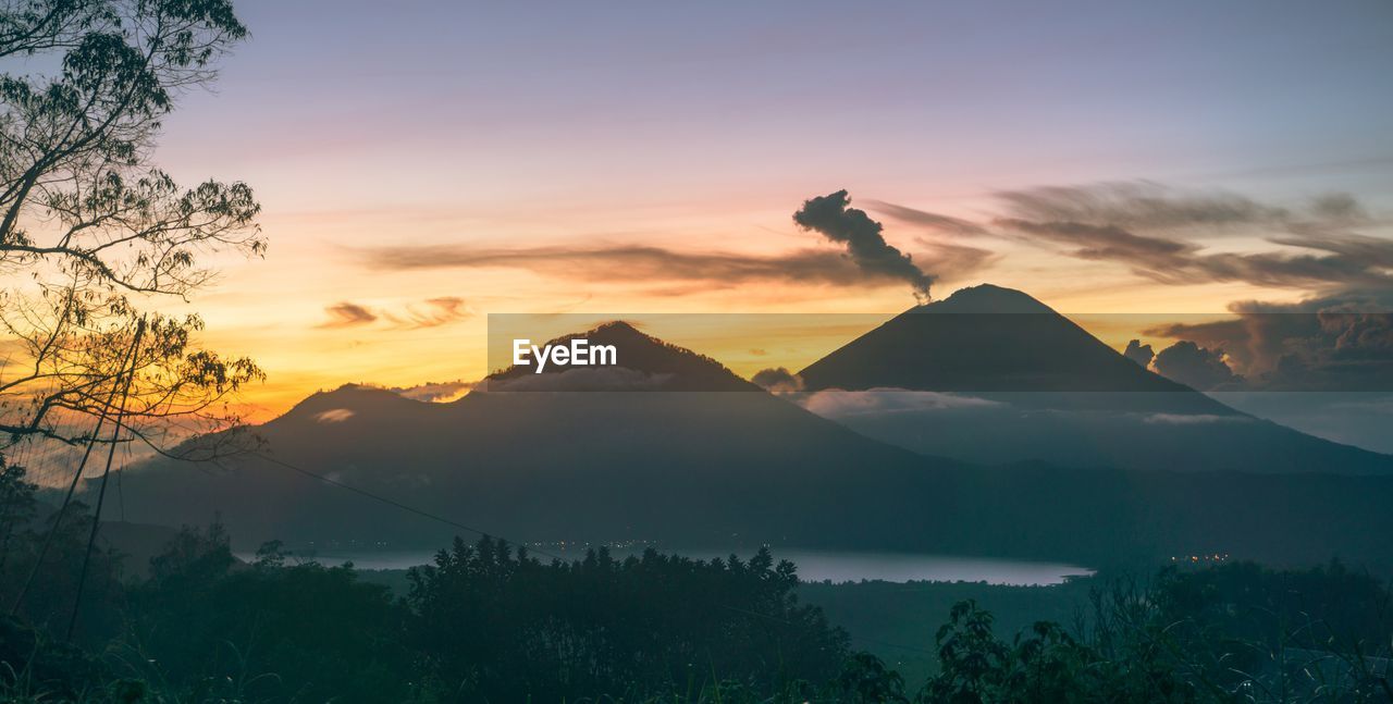 Scenic view of mountains against sky during sunset