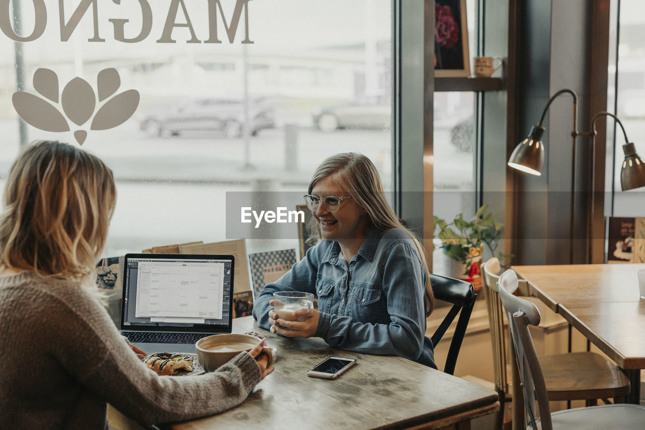 Women having coffee in cafe