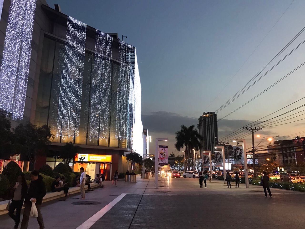 PEOPLE ON CITY STREET WITH SKYSCRAPERS