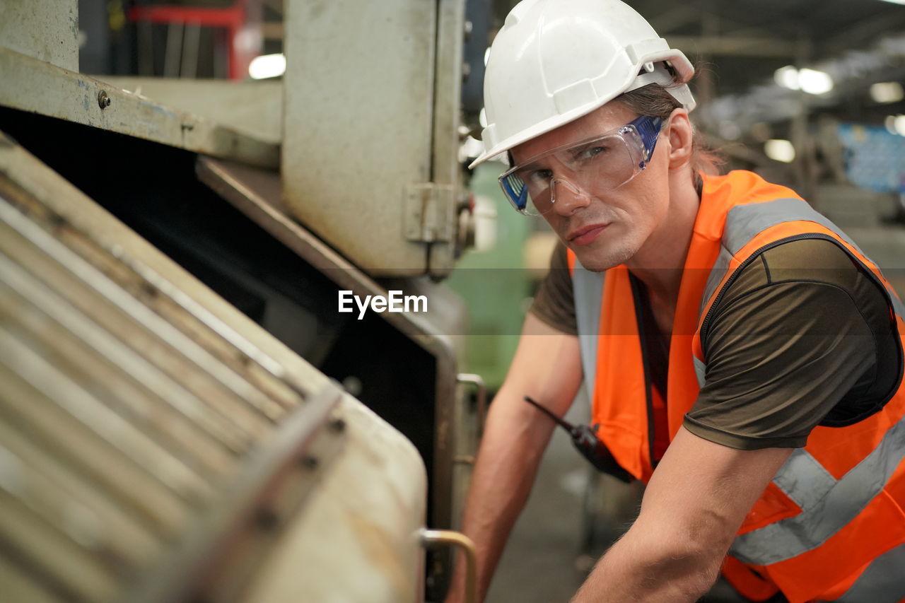 side view of man working in workshop