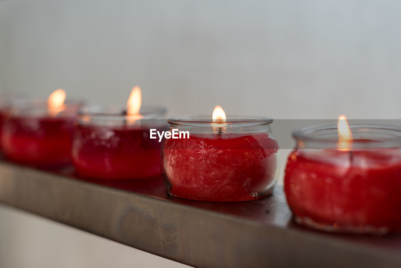 burning, fire, flame, candle, red, heat, indoors, nature, no people, close-up, selective focus, group of objects, illuminated, lighting, food, domestic room