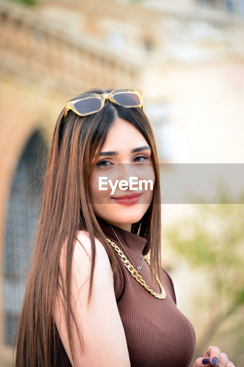 women, portrait, adult, one person, female, young adult, fashion, smiling, portrait photography, long hair, hairstyle, photo shoot, happiness, looking at camera, glasses, clothing, person, lifestyles, emotion, brown hair, human face, sunglasses, arts culture and entertainment, nature, outdoors, fashion accessory, skin, cheerful, child, blond hair, city, focus on foreground, human hair, architecture, summer, headshot, casual clothing, teenager, looking, day, sunlight, human eye, leisure activity, relaxation, teeth