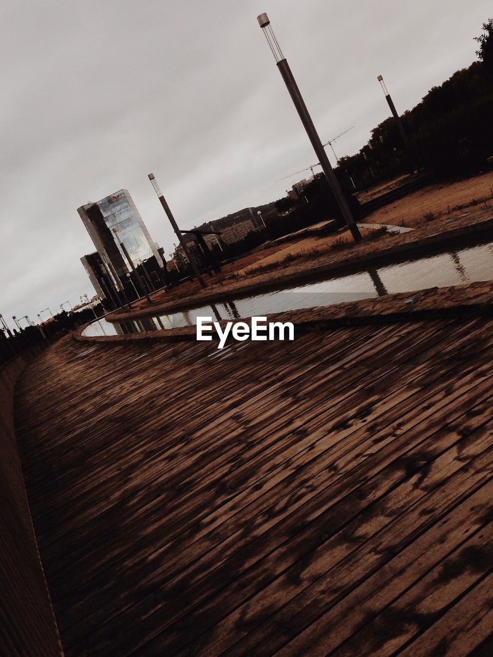 Tilt image of boardwalk against sky