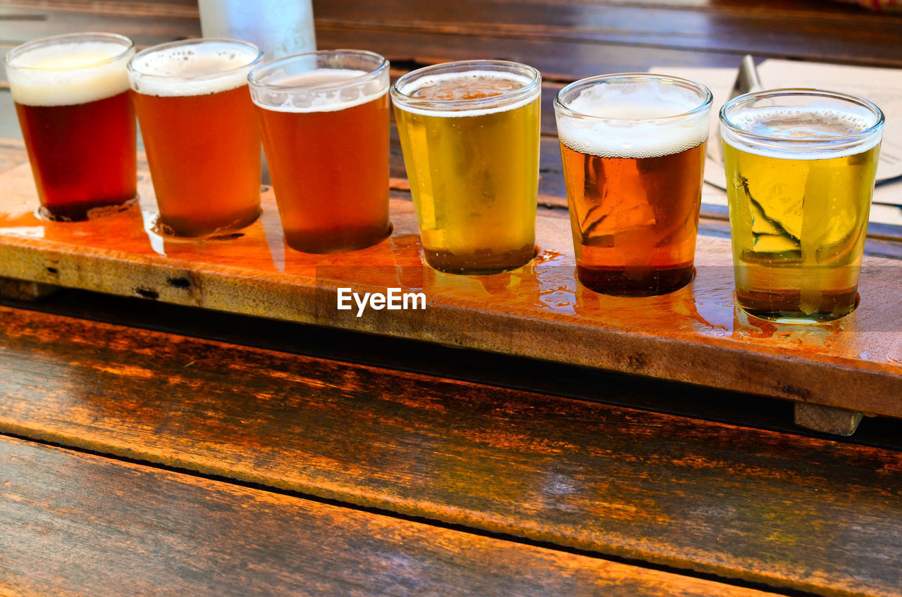 Close-up of beer selection in glasses on table 