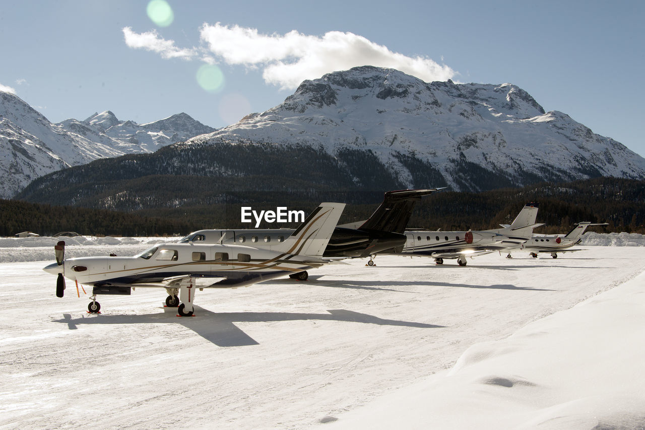 Private jets and aircrafts in the airport of engadine st moritz in winter time