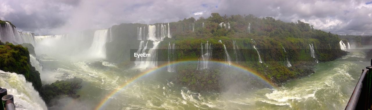 PANORAMIC VIEW OF RAINBOW OVER WATER