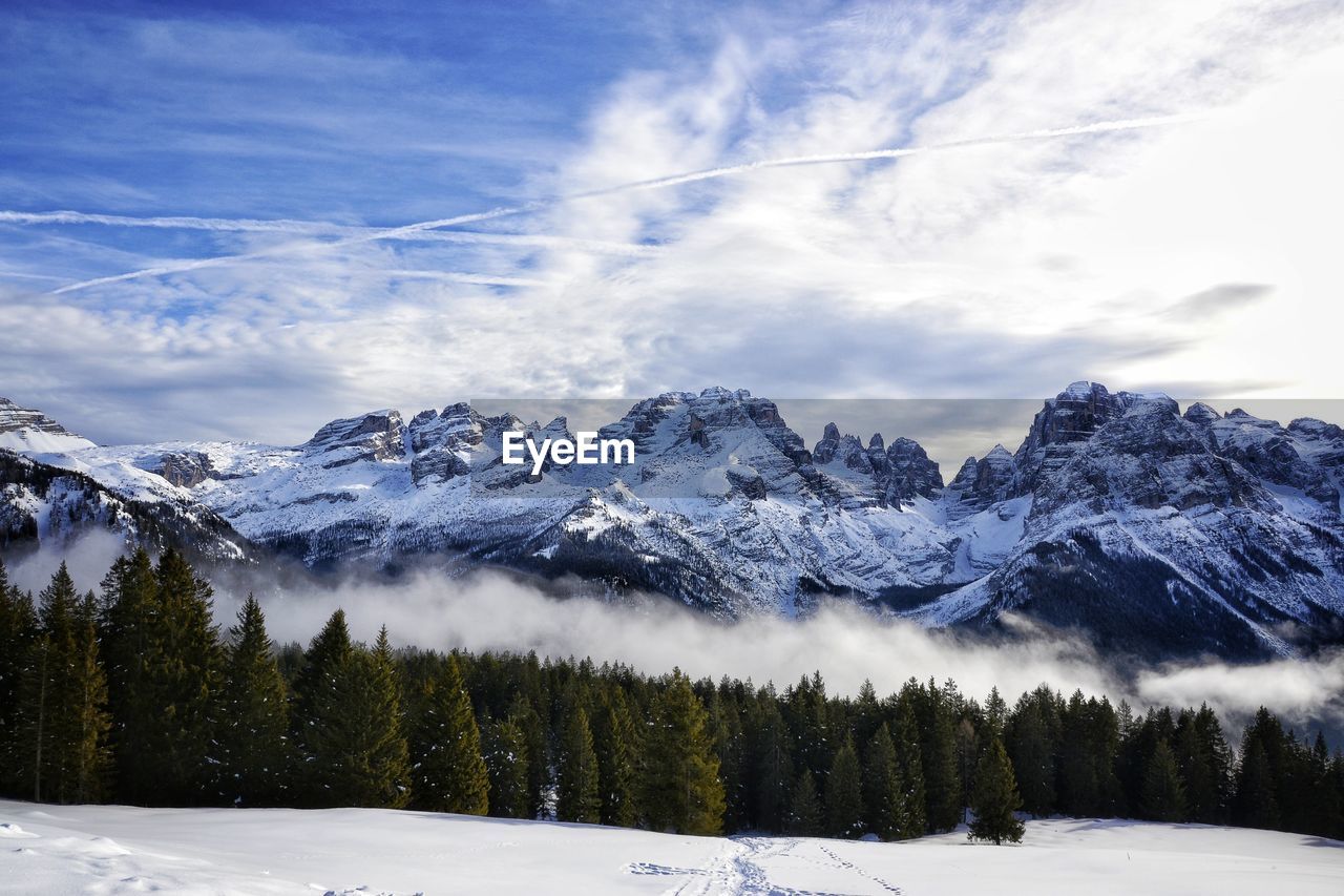 Scenic view of snowcapped mountains against sky