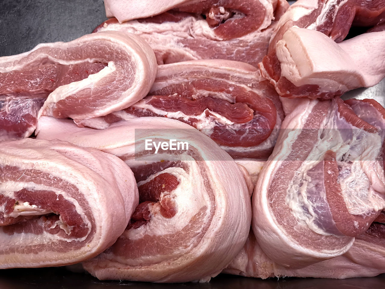 Raw pork meat pile in market