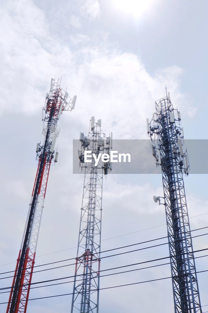 Low angle view of communications tower against sky