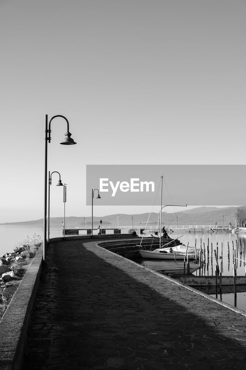 STREET BY PIER AGAINST SKY