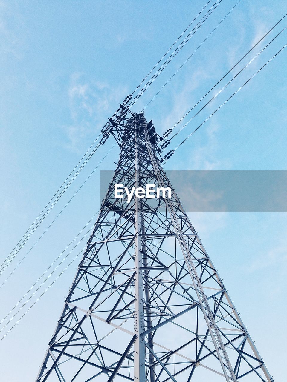 LOW ANGLE VIEW OF ELECTRICITY PYLONS