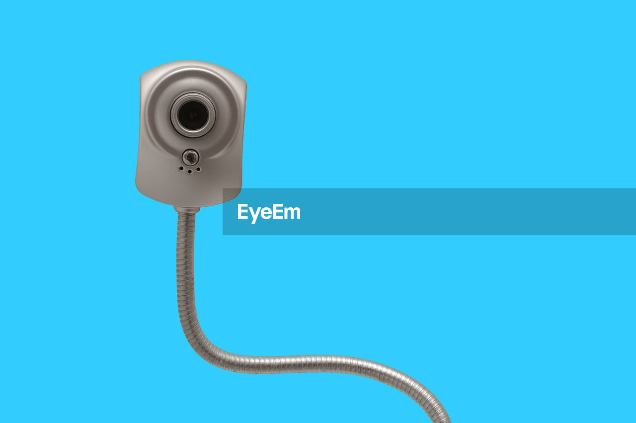 Close-up of webcam over blue background