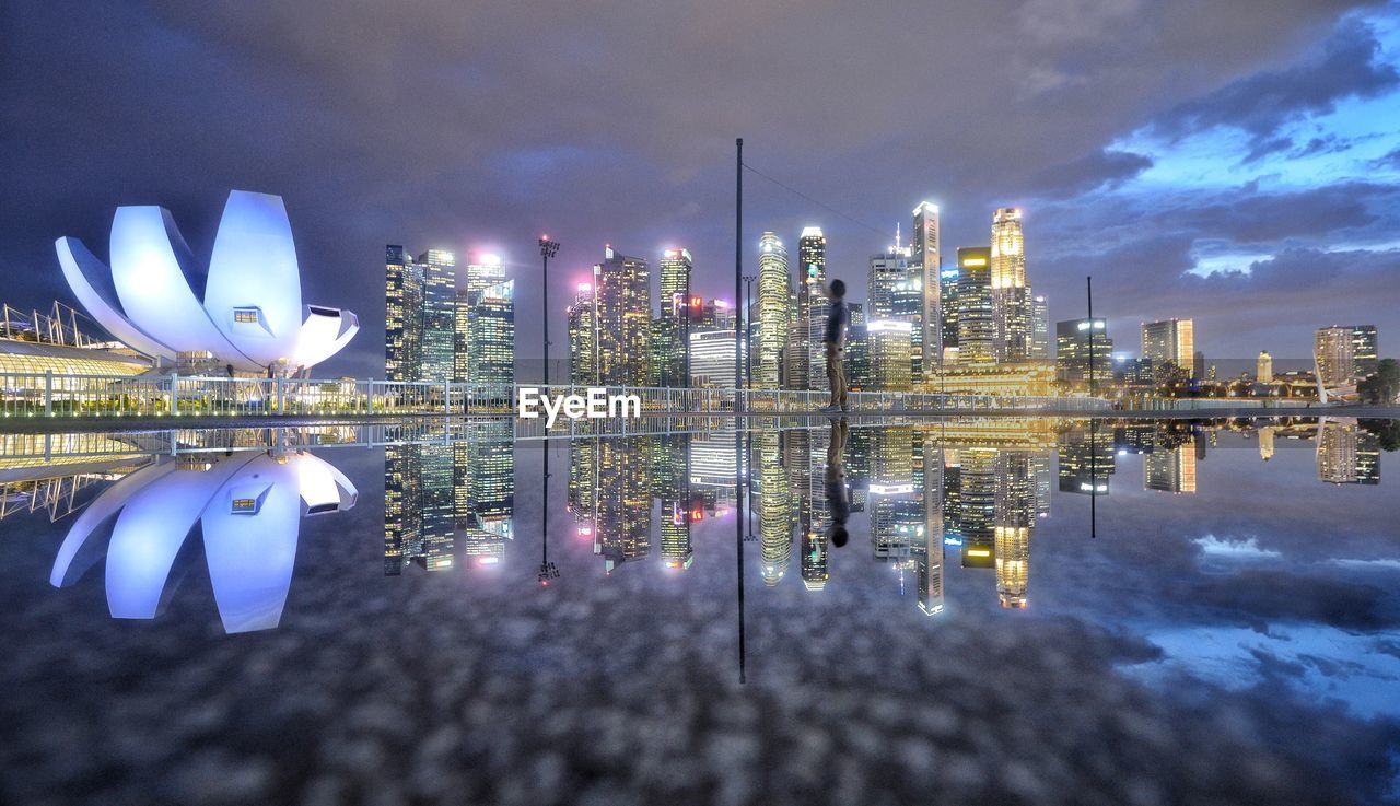 Illuminated modern buildings in city at night