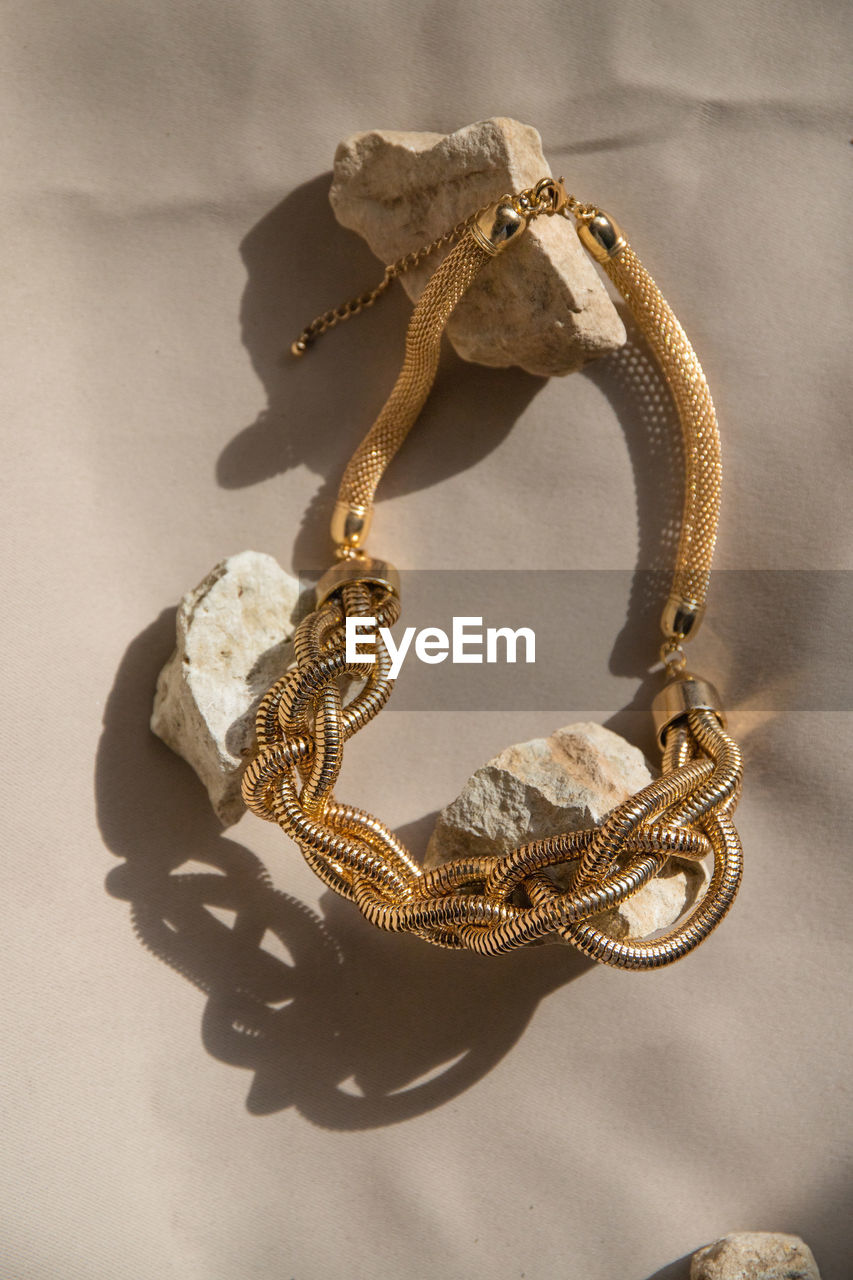 high angle view of pearl jewelry on table