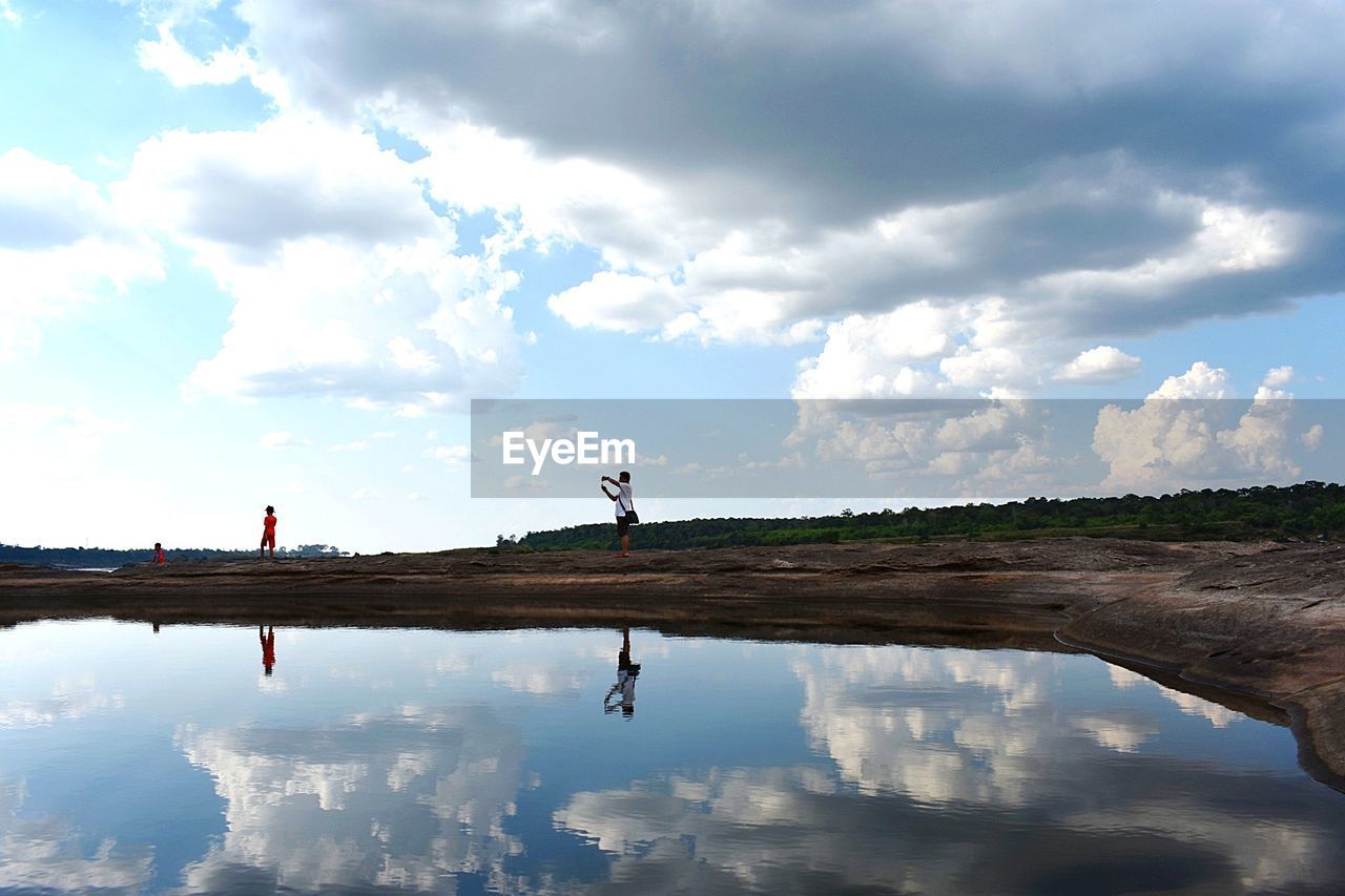 Reflection of clouds in lake against sky