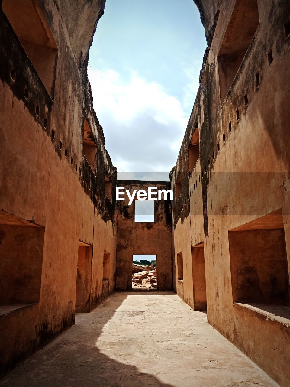 Narrow alley amidst buildings in city