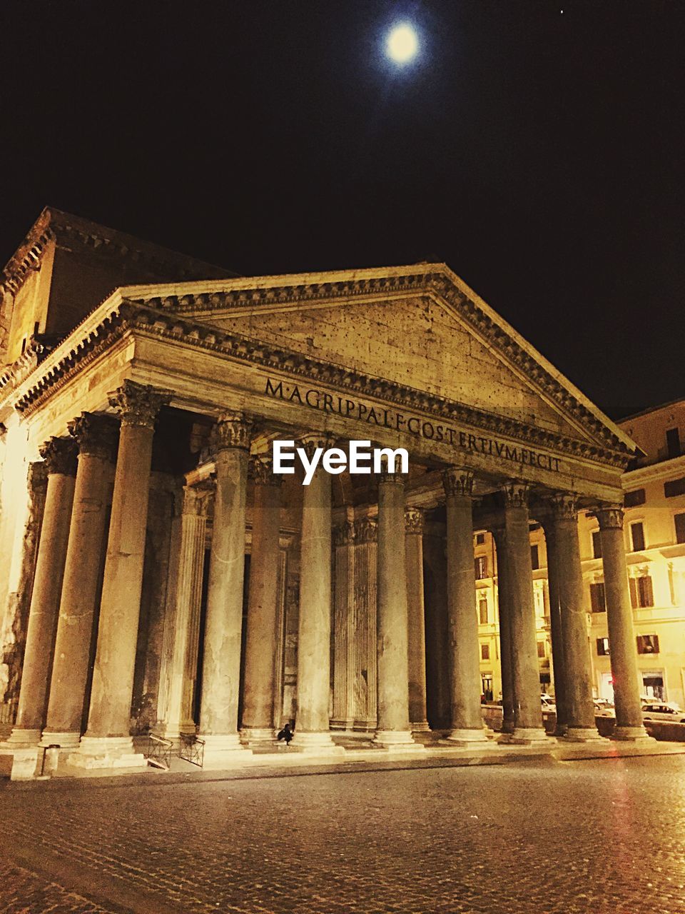 Low angle view of illuminated building at night