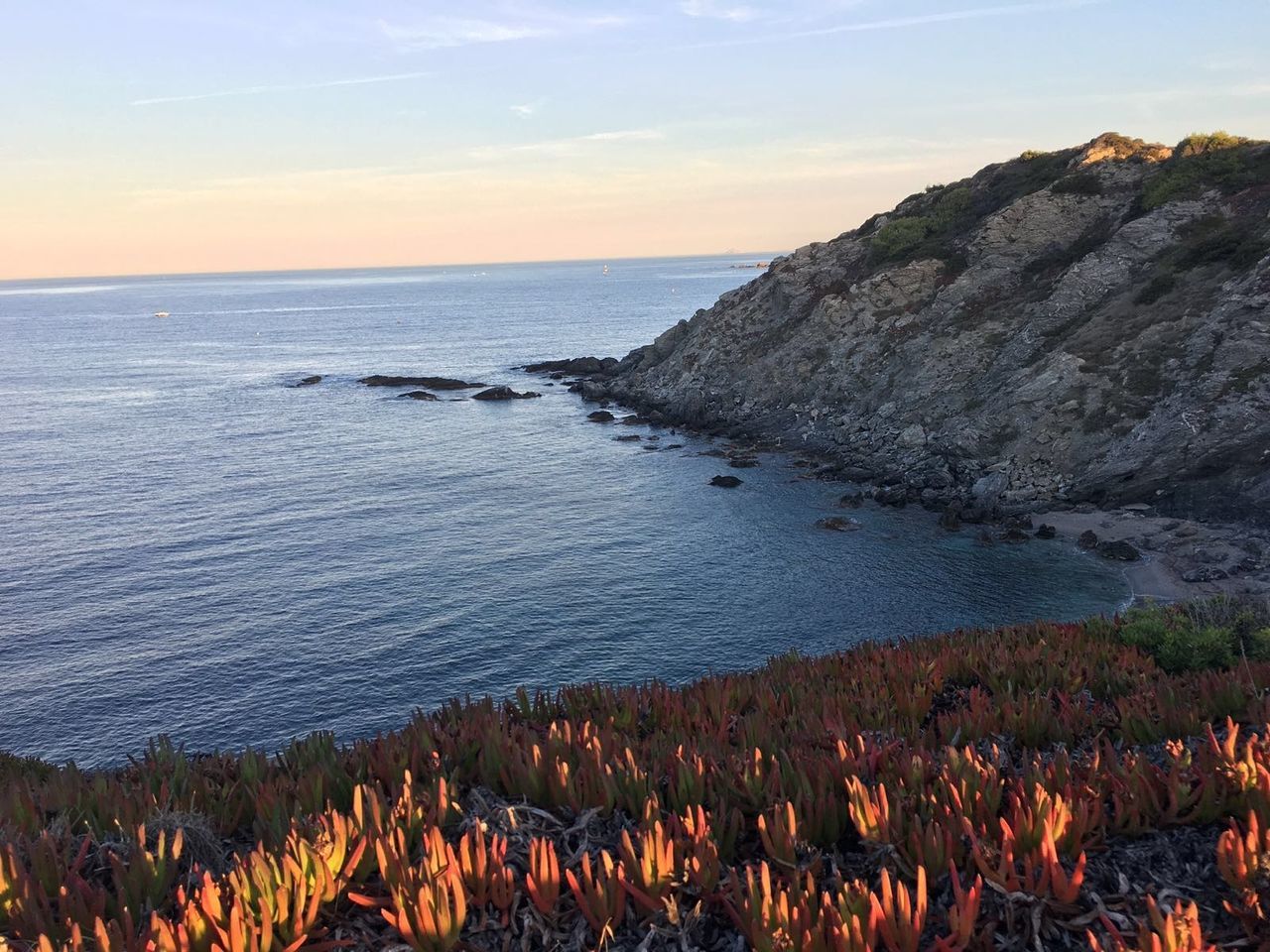 Scenic view of sea against sky during sunset