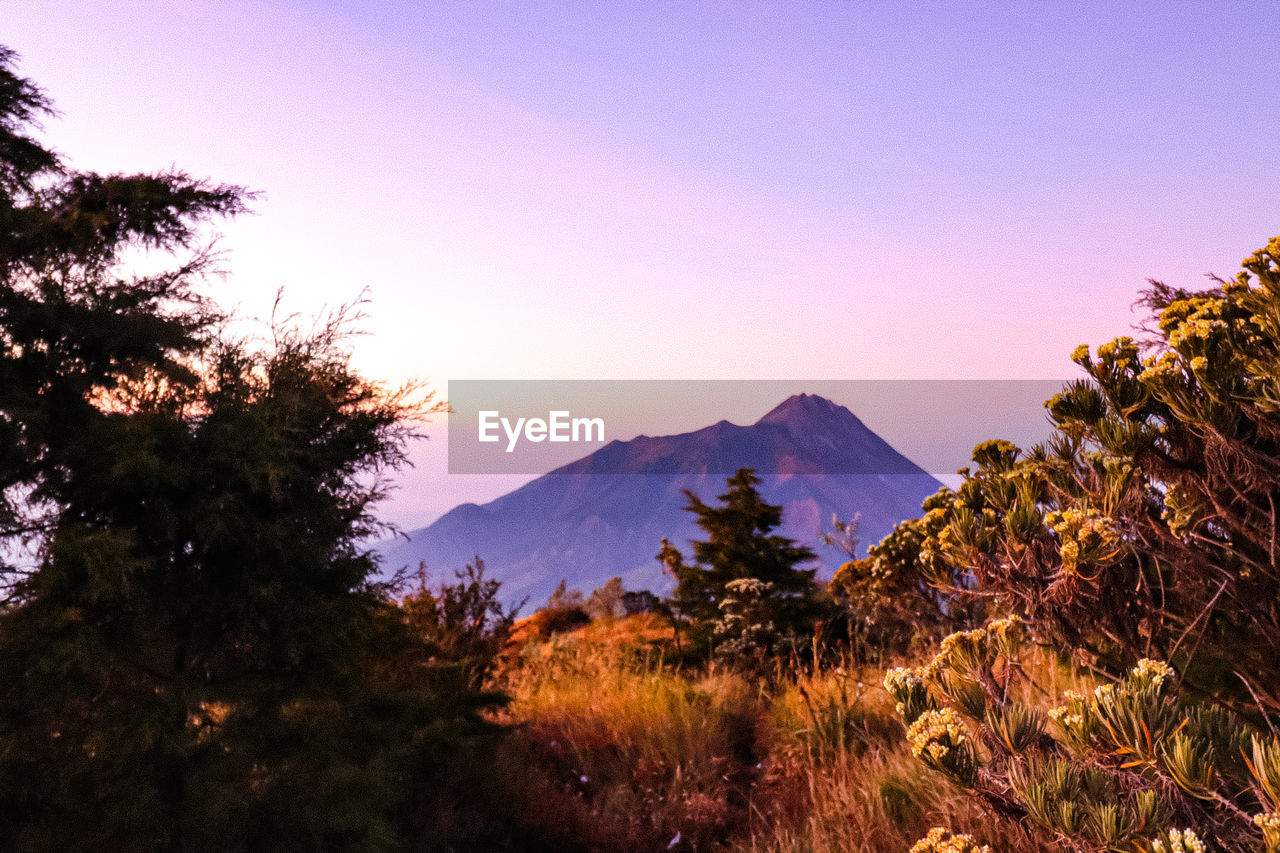 Scenic view of mountains against sky during sunset