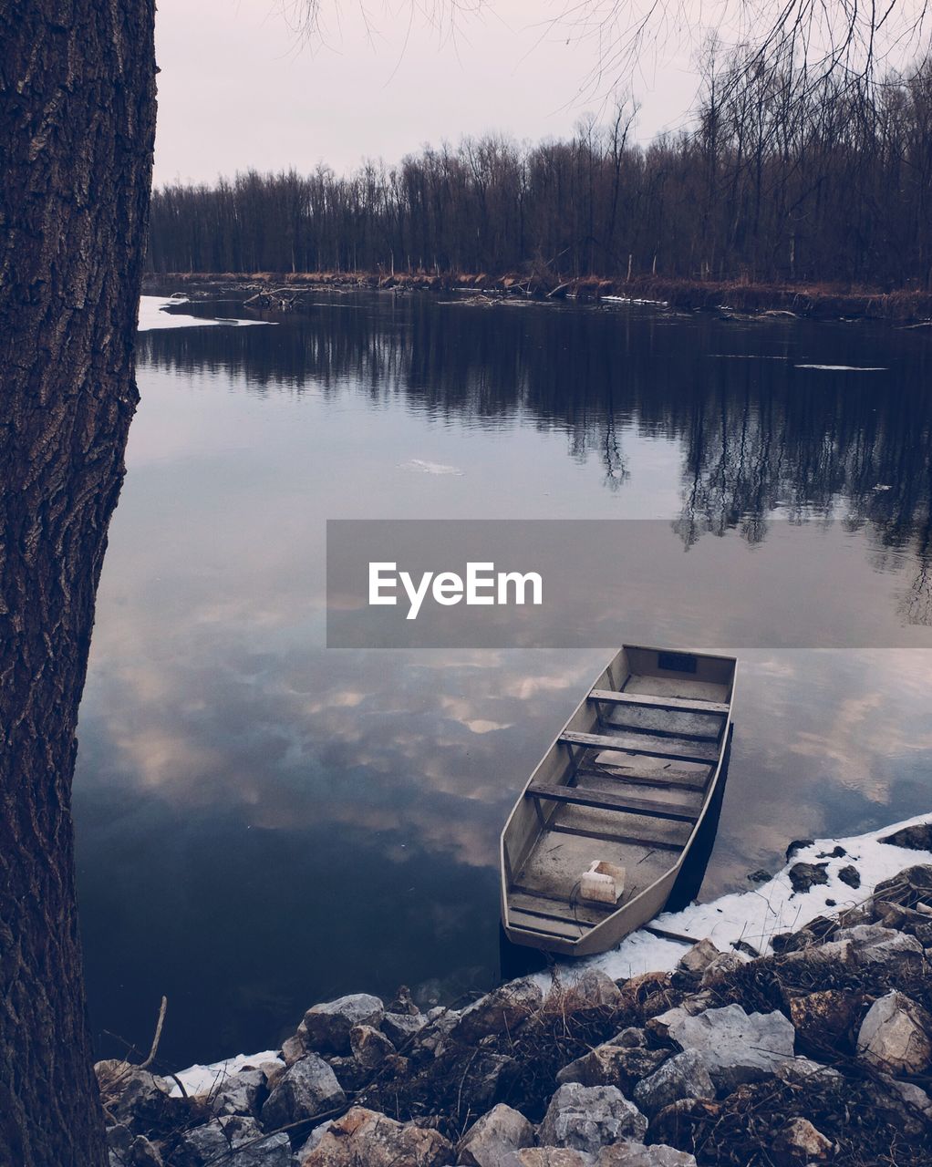 Scenic view of lake against sky during winter
