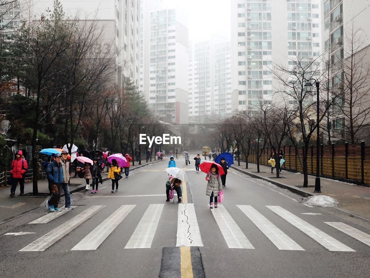 PEOPLE WALKING ON STREET IN CITY