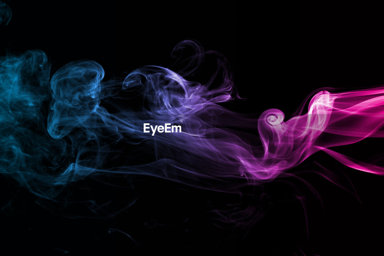 Close-up of smoke against black background 