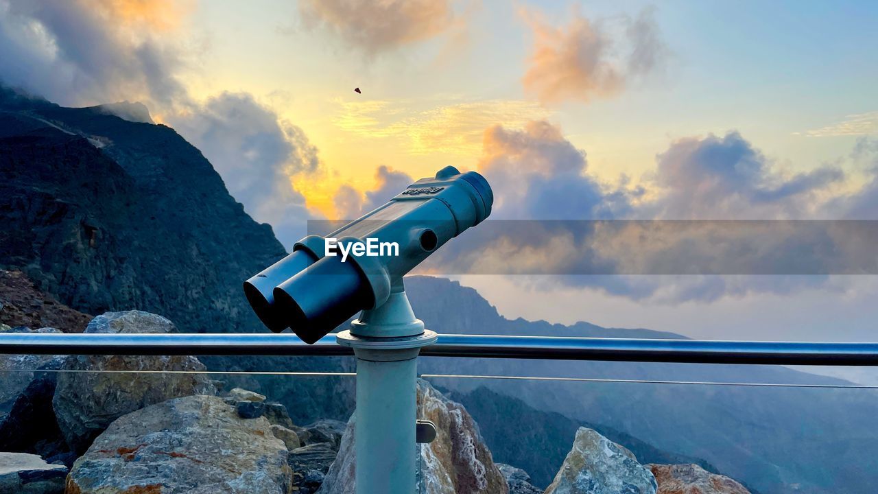 sky, blue, cloud, nature, scenics - nature, water, beauty in nature, sunset, mountain, sea, binoculars, landscape, technology, environment, reflection, travel destinations, travel, telescope, outdoors, coin-operated binoculars, astronomy, optical instrument, no people, coin operated, surveillance, tranquility