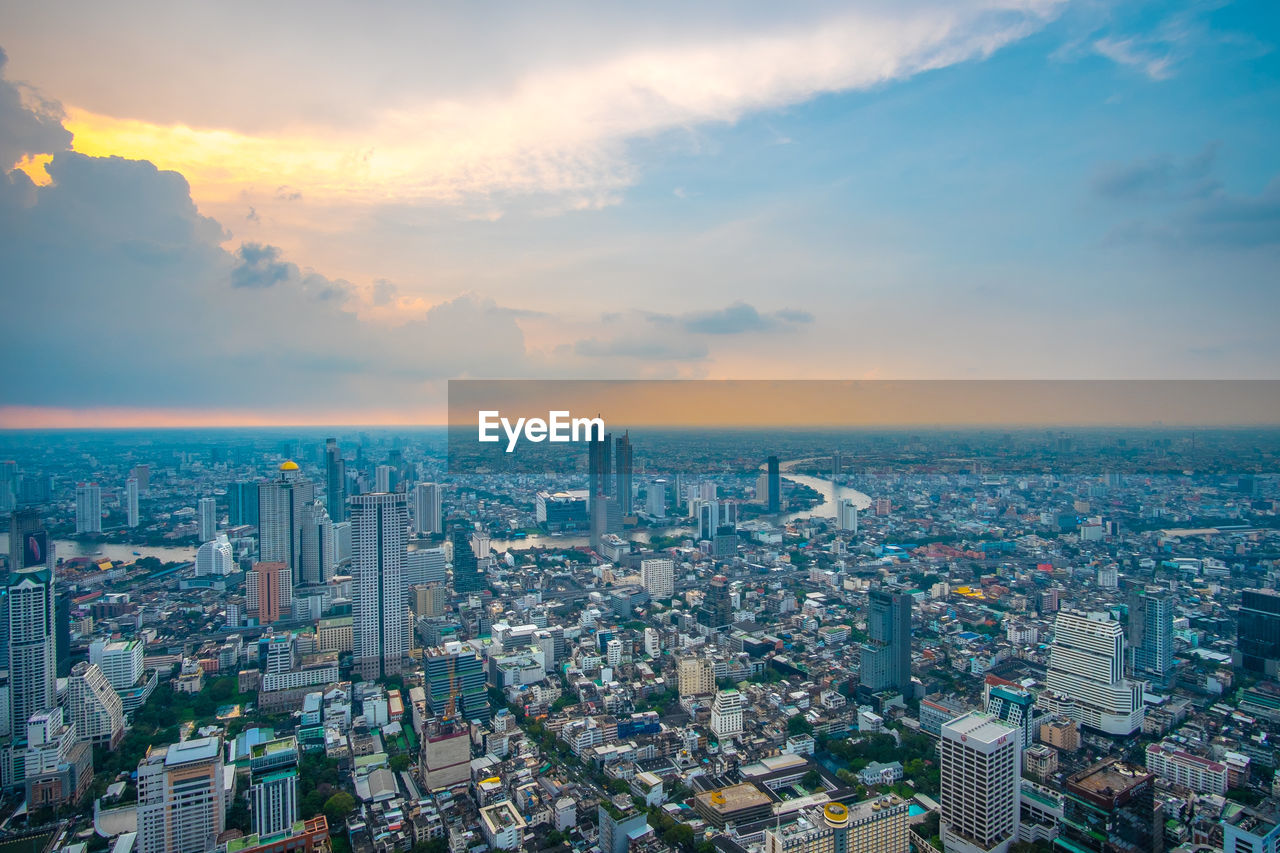 HIGH ANGLE VIEW OF CITY BUILDINGS AGAINST SKY