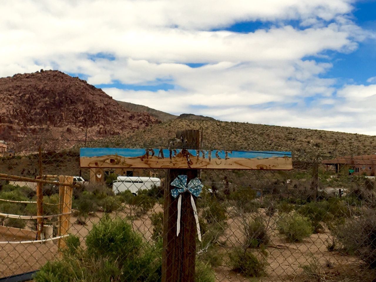 VIEW OF MOUNTAINS AGAINST CLOUDY SKY