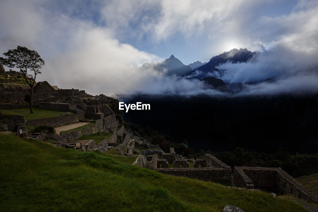 View of old ruins against cloudy sky