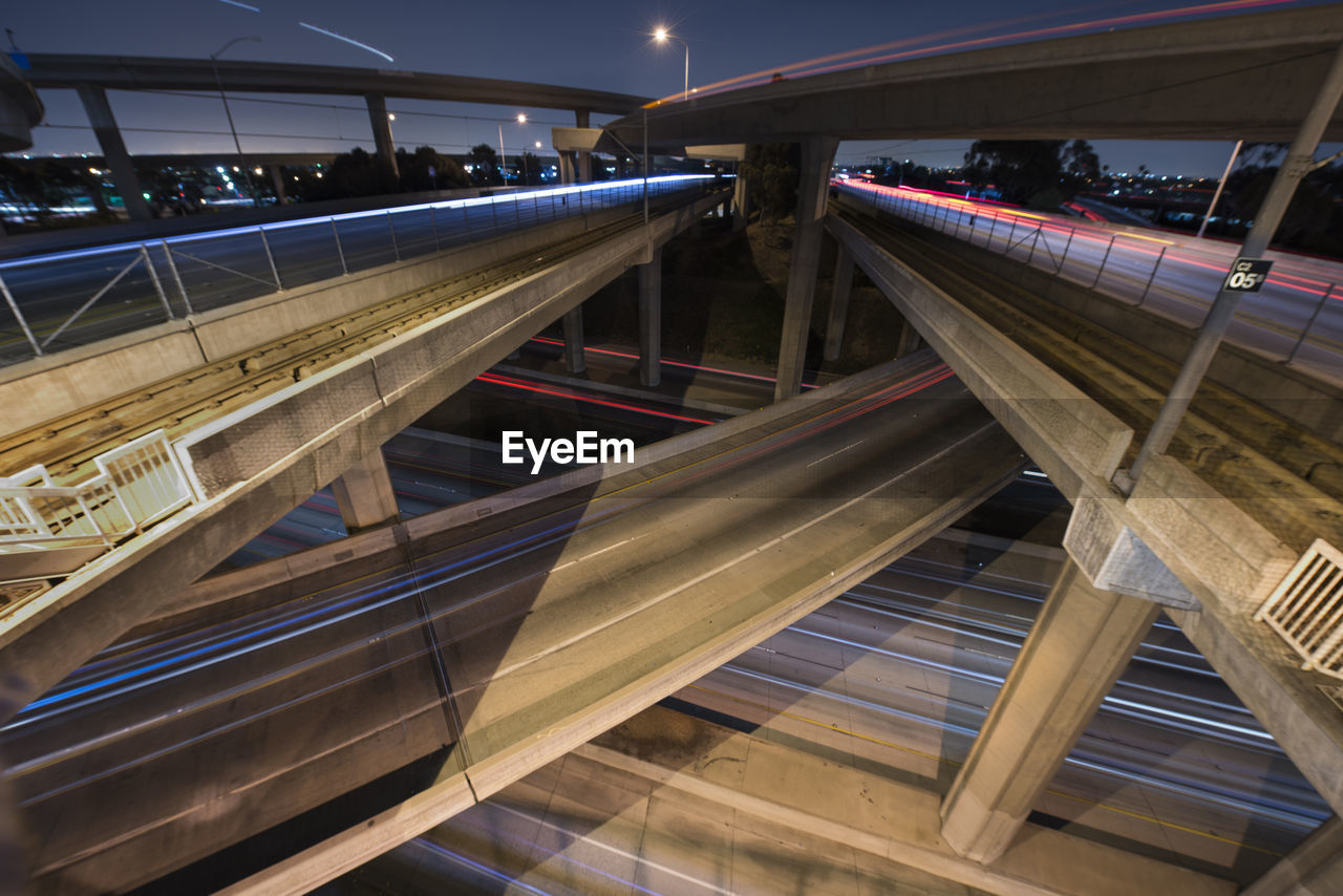 Light trails on elevated roads in city at night