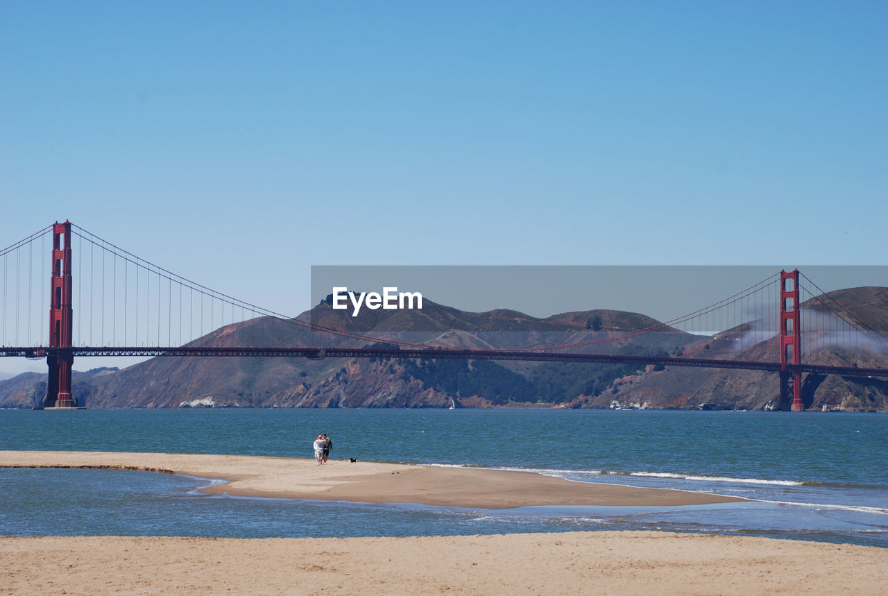 VIEW OF SUSPENSION BRIDGE AGAINST SKY