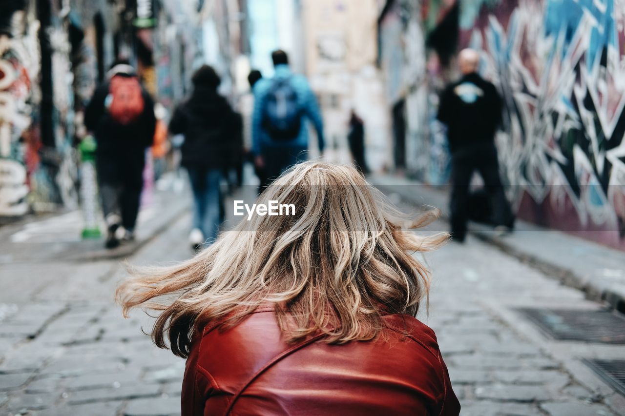 Rear view of woman walking outdoors