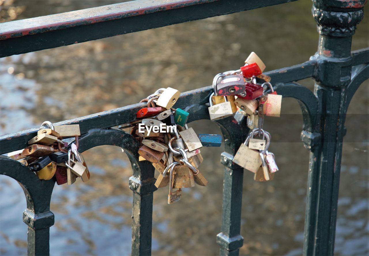 PADLOCKS HANGING ON RAILING